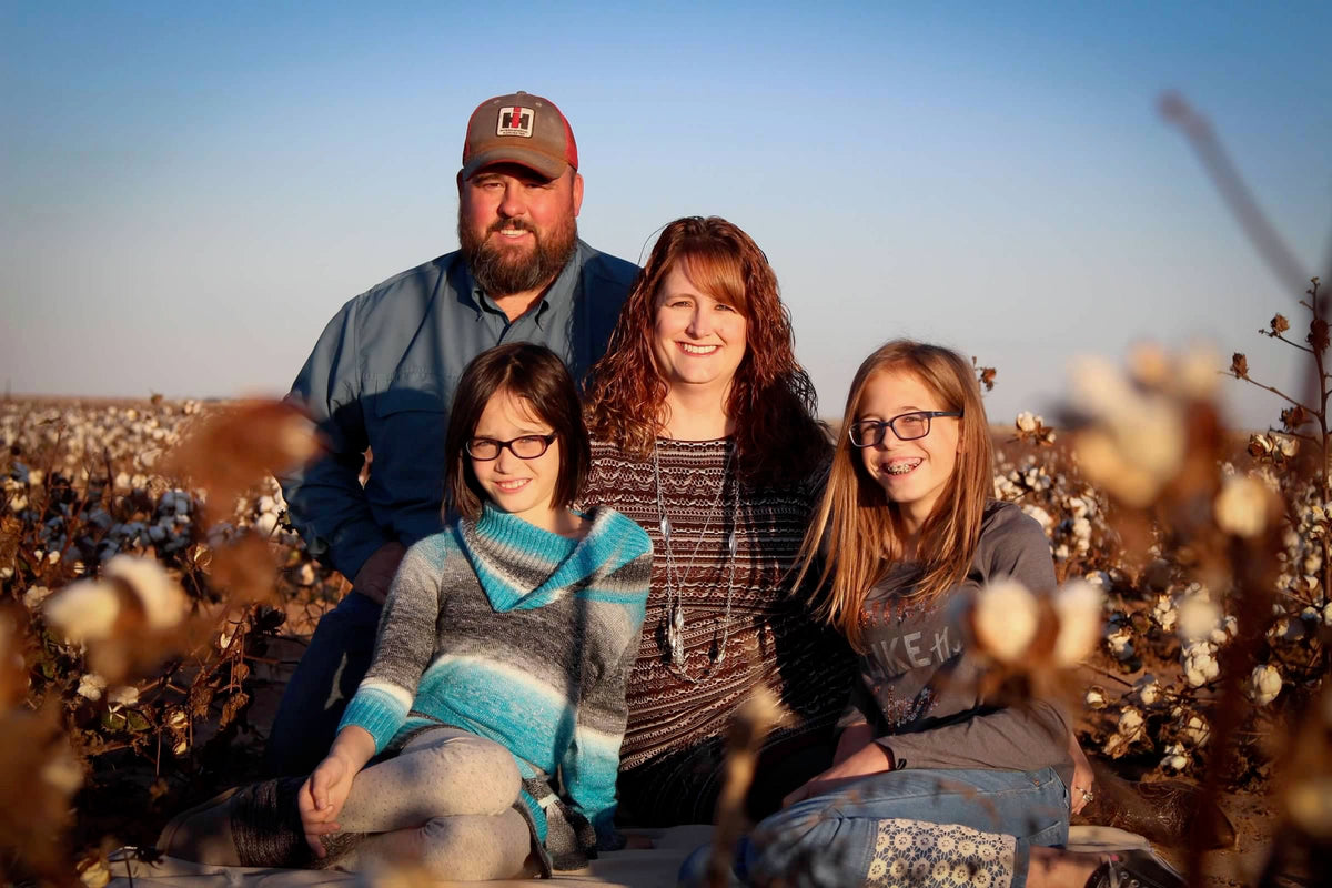 Mike Thompson and his family in a regenerative cotton field on their Texas farm. 